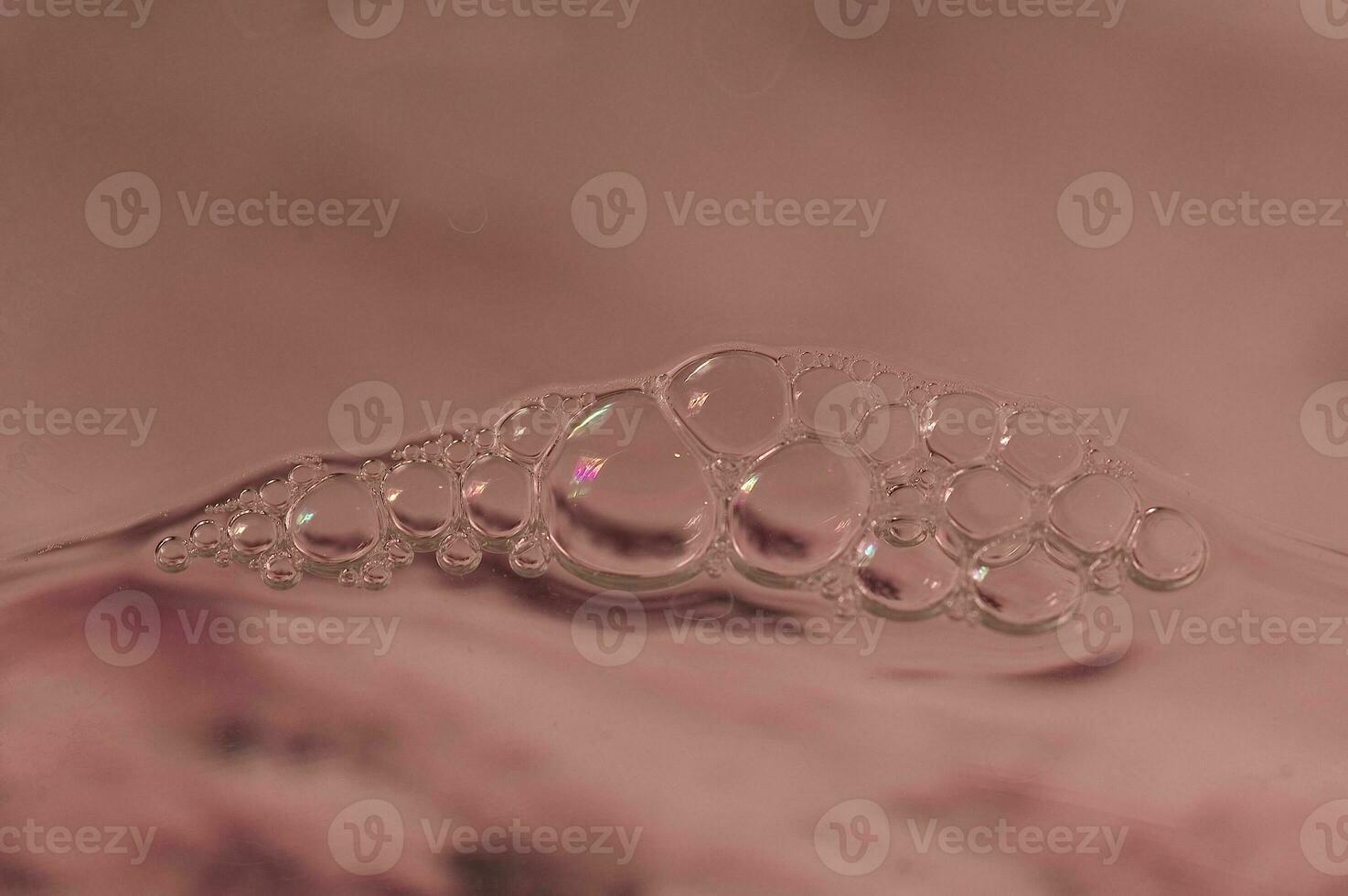original colorful background with foam on the water surface photo