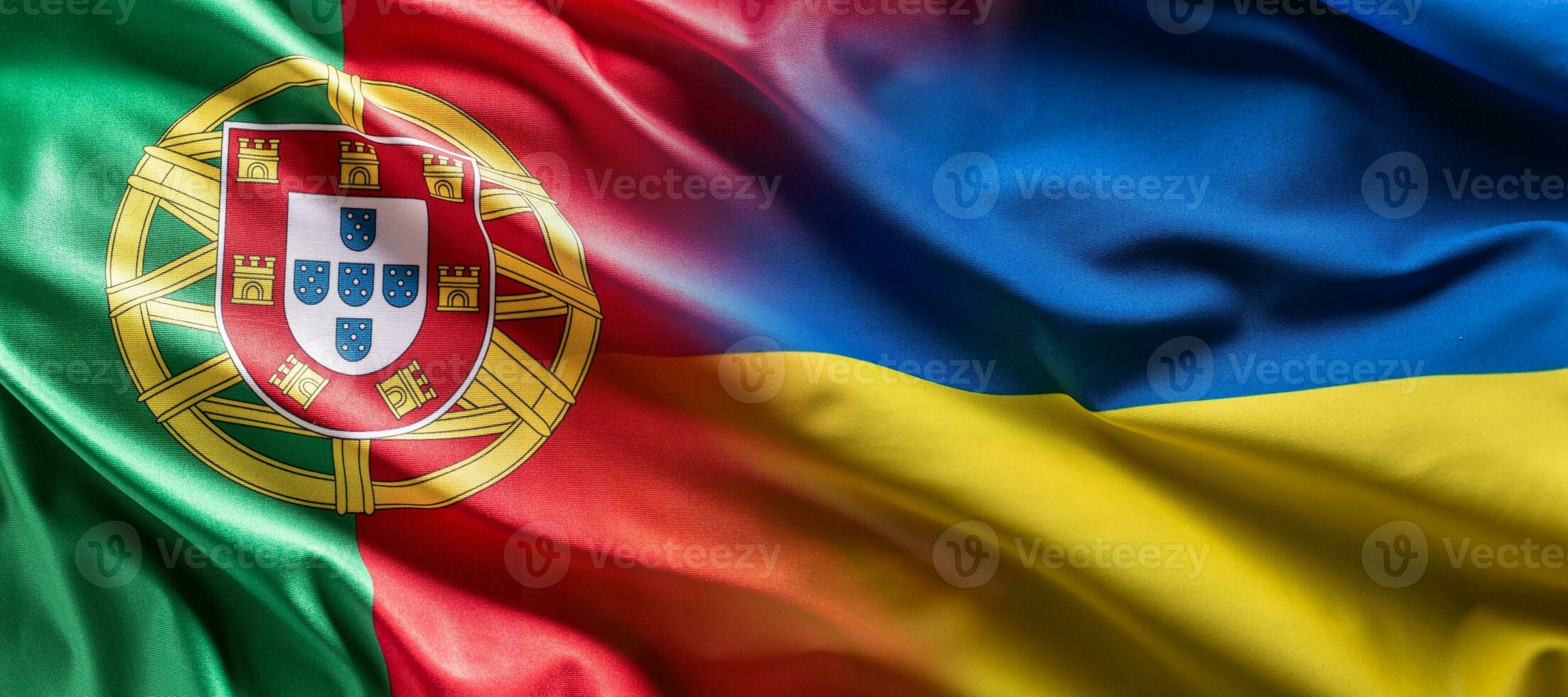 Waving flag concept of Ukraine and Portugal symbolising political connection photo