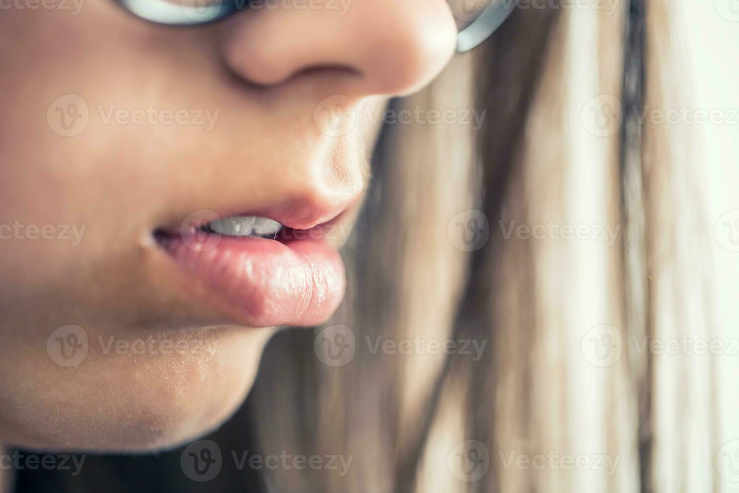 Closeup of beautiful young girl healthy lips photo