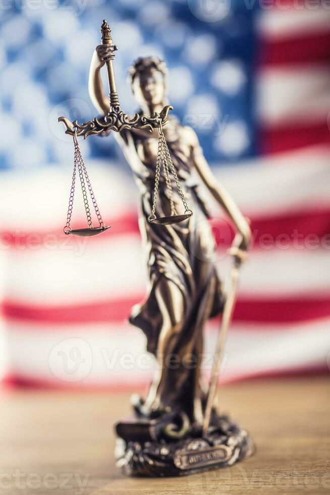 Lady Justice and American flag. Symbol of law and justice with USA Flag photo