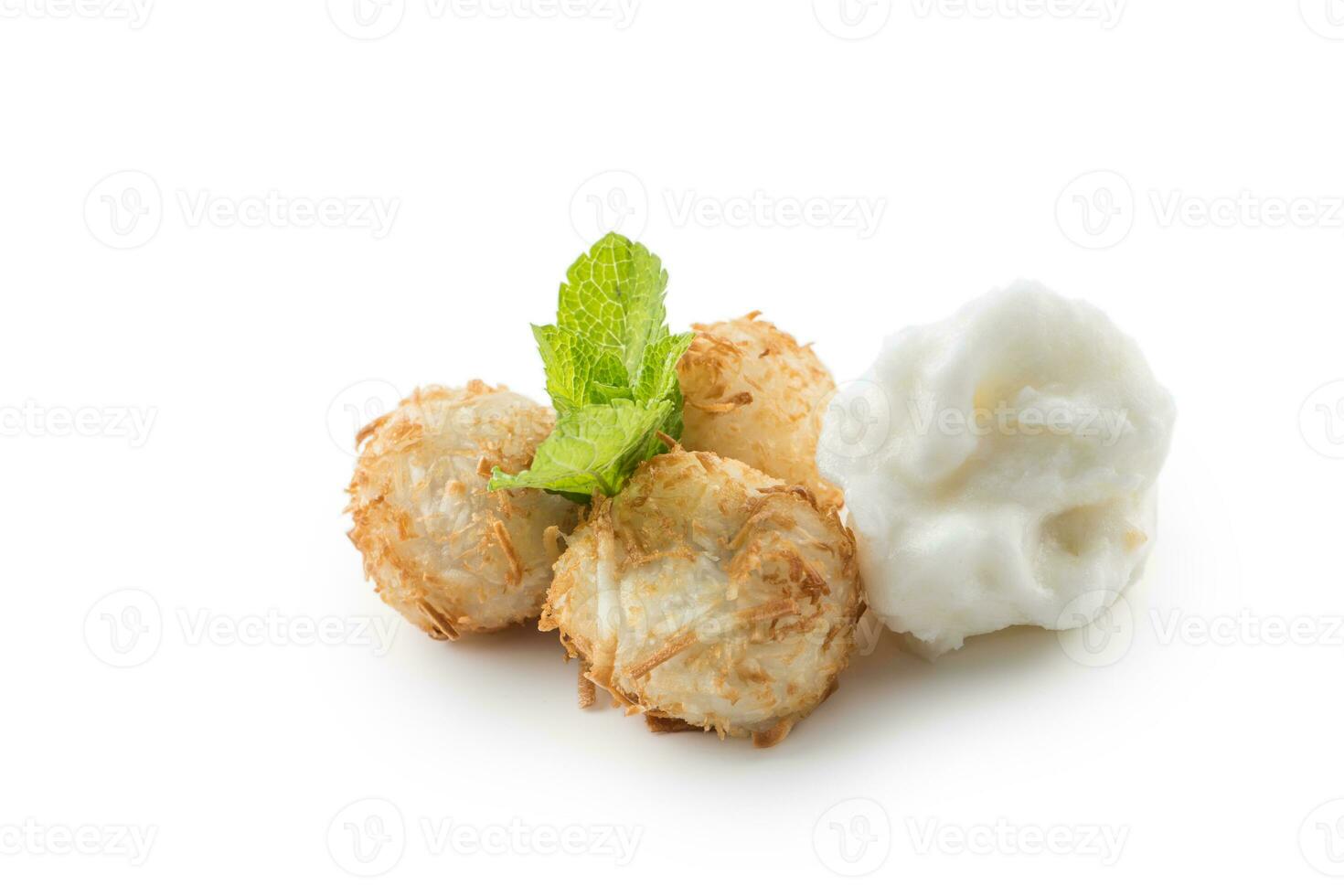 Traditional japanese fried sweet coconut balls with mint leaves and sorbet. photo