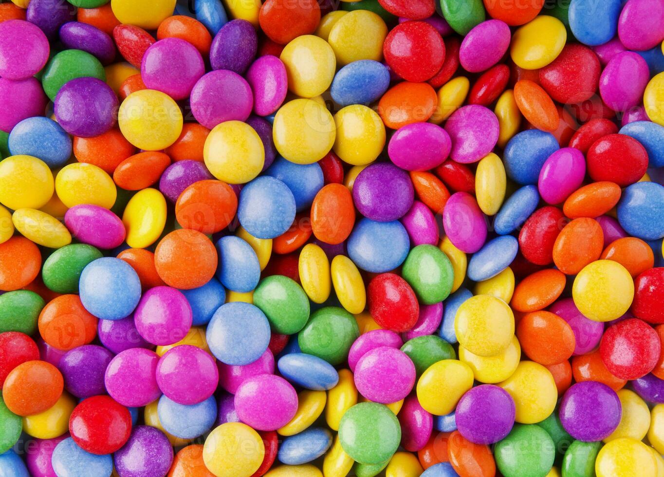 A colorful and tasty bunch of chocolate or fruit sweets photo