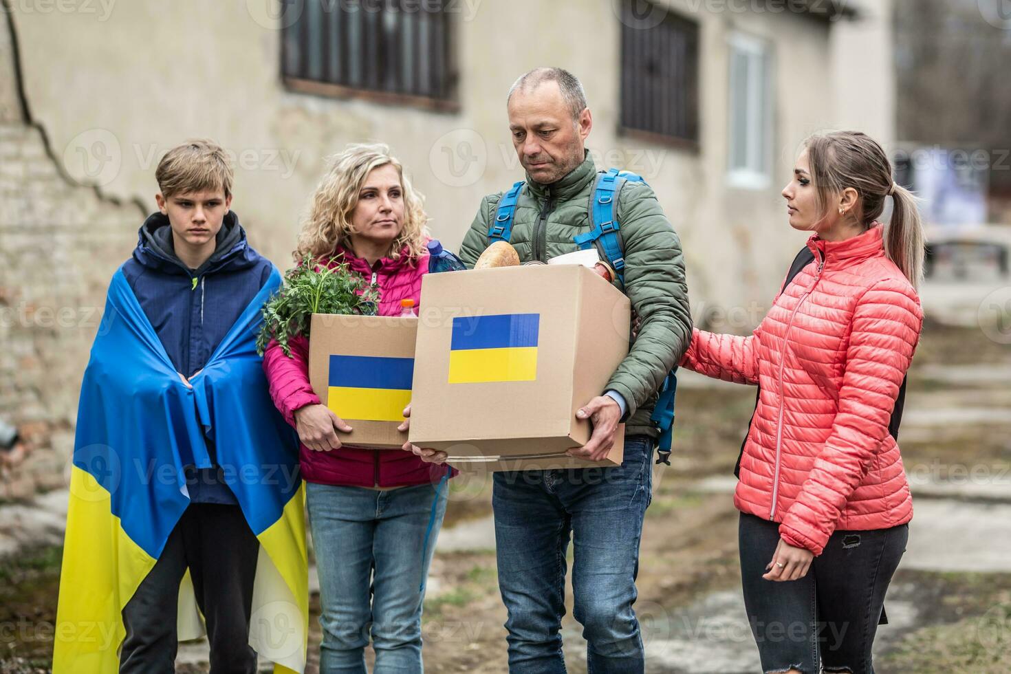Vysne Nemecke, Slovakia. March 30. 2022. Ukrainian family accepts boxes of humanitarian help after Russia attacked Ukraine creating the crisis photo