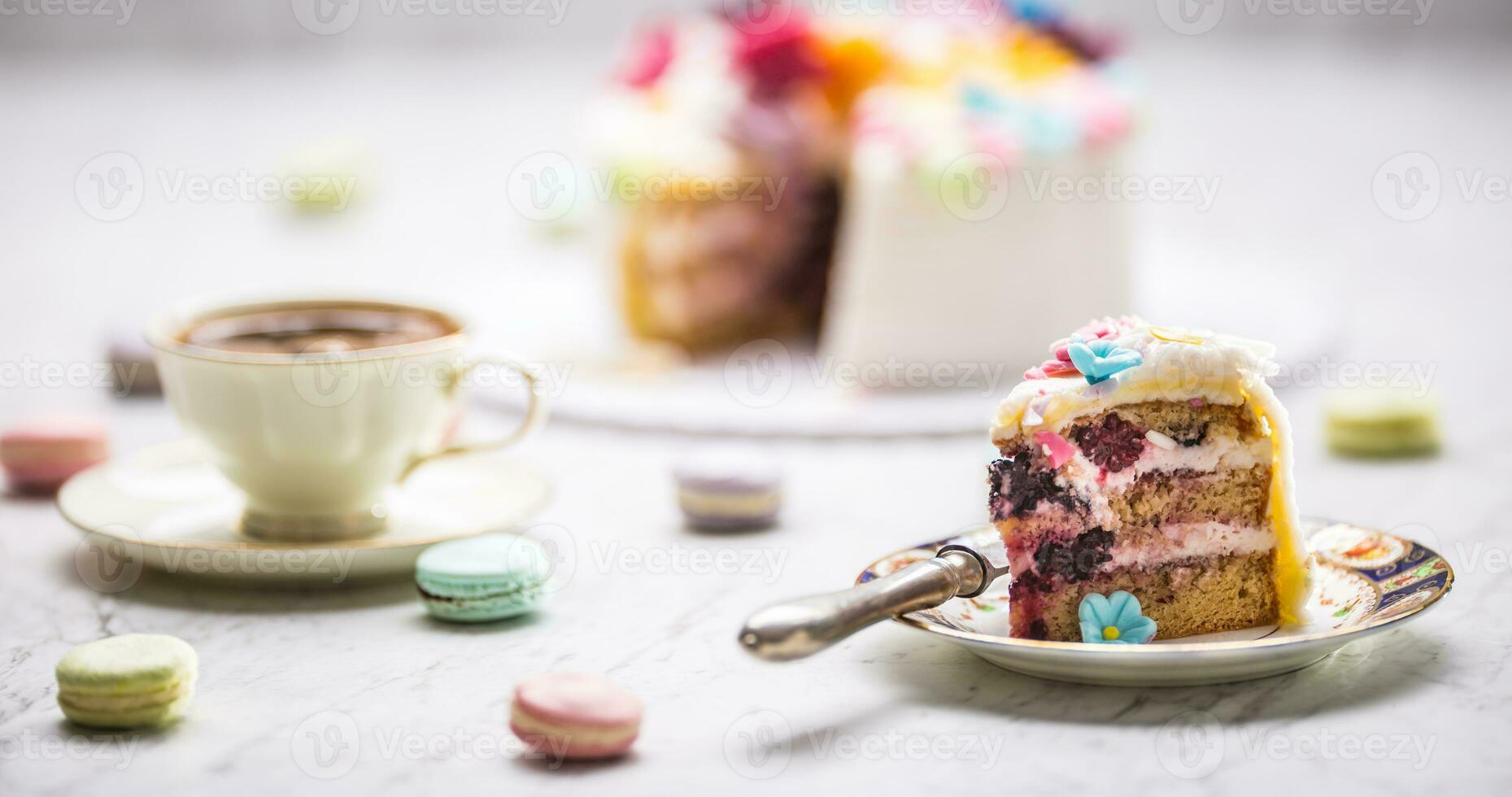 Cake from marzipan flowers macaroons and  black coffee. photo