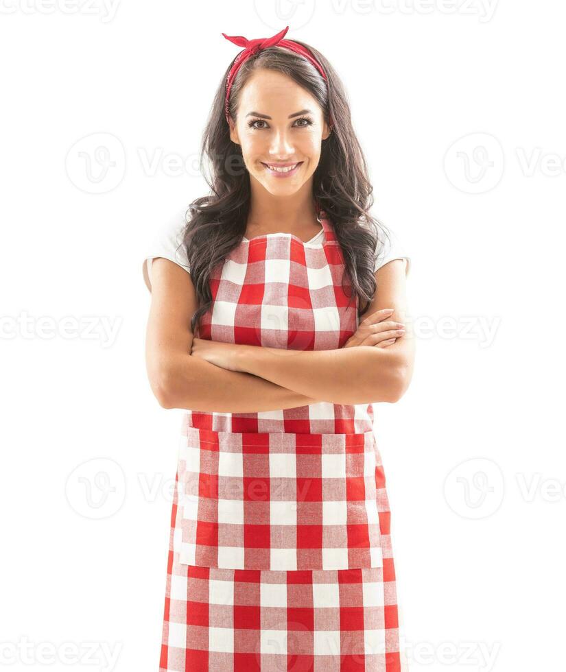 Beautiful housekeeper on isolated background, smiling with arms crossed on her chest photo