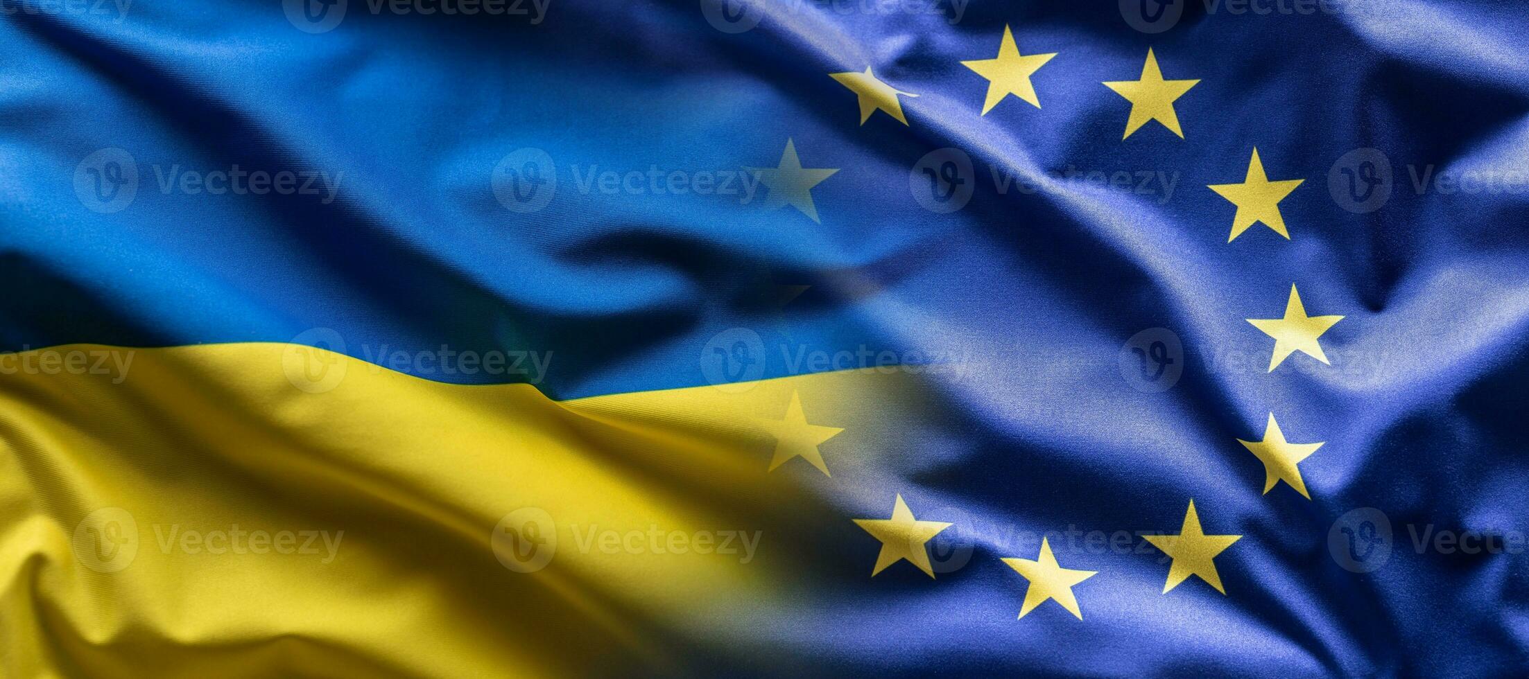 Ukrainian and the EU flag blending into each other as European Union leans towards the membership of Ukraine photo