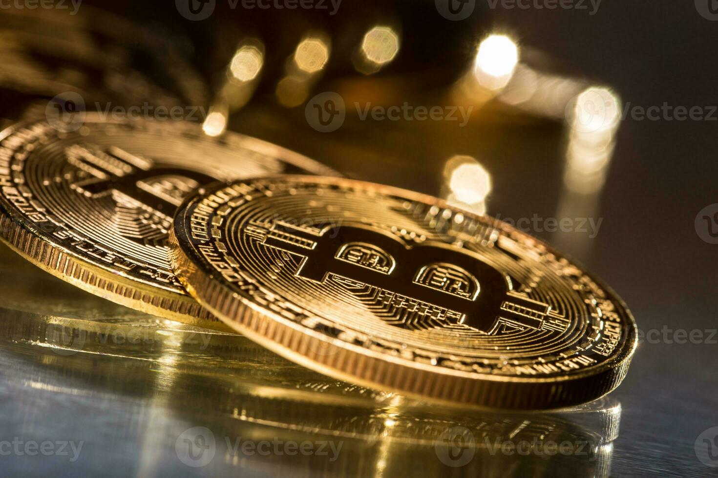 Bitcoin. Golden and silver bitcoins - virtual cryptocurrency photo