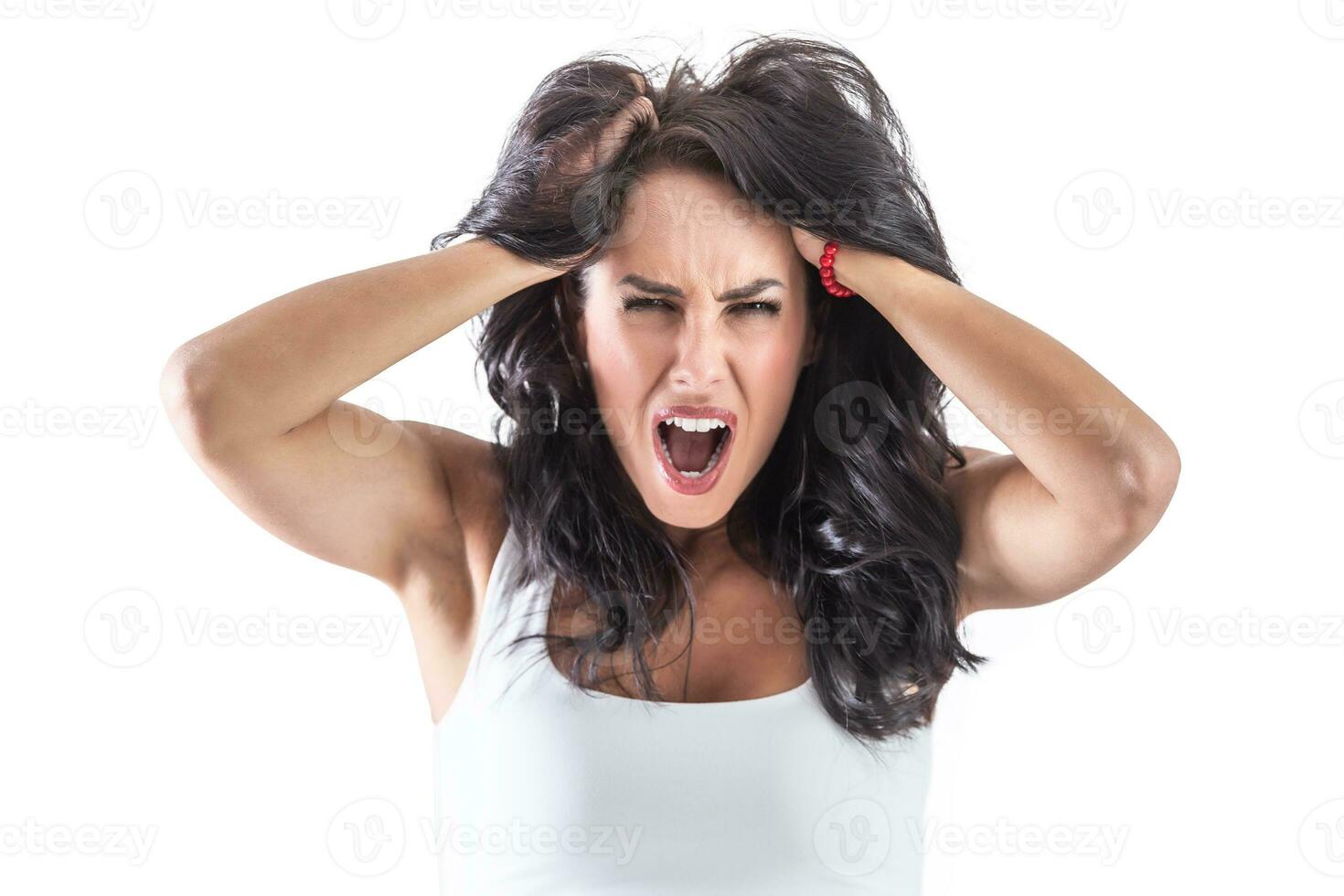 Brunette woman holding her head because of strong headache. Isolated background photo