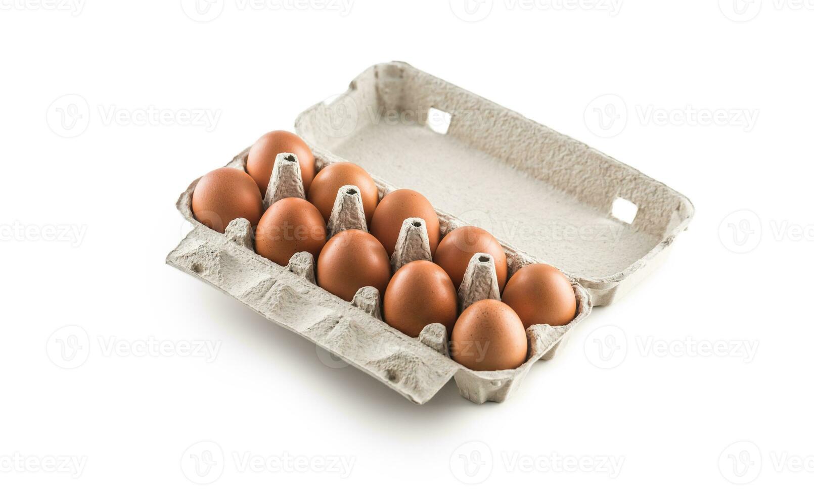 Fresh chicken eggs in pater tray isolated on white background photo