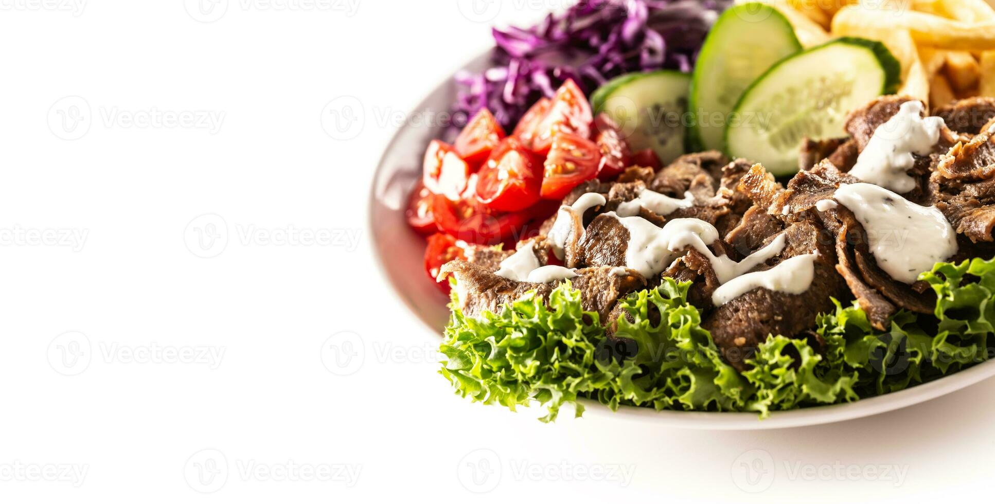 Savory Turkish veal kebab served with fresh vegetables, letuce, french fires and lovely and delicious dip, mayonnaise photo