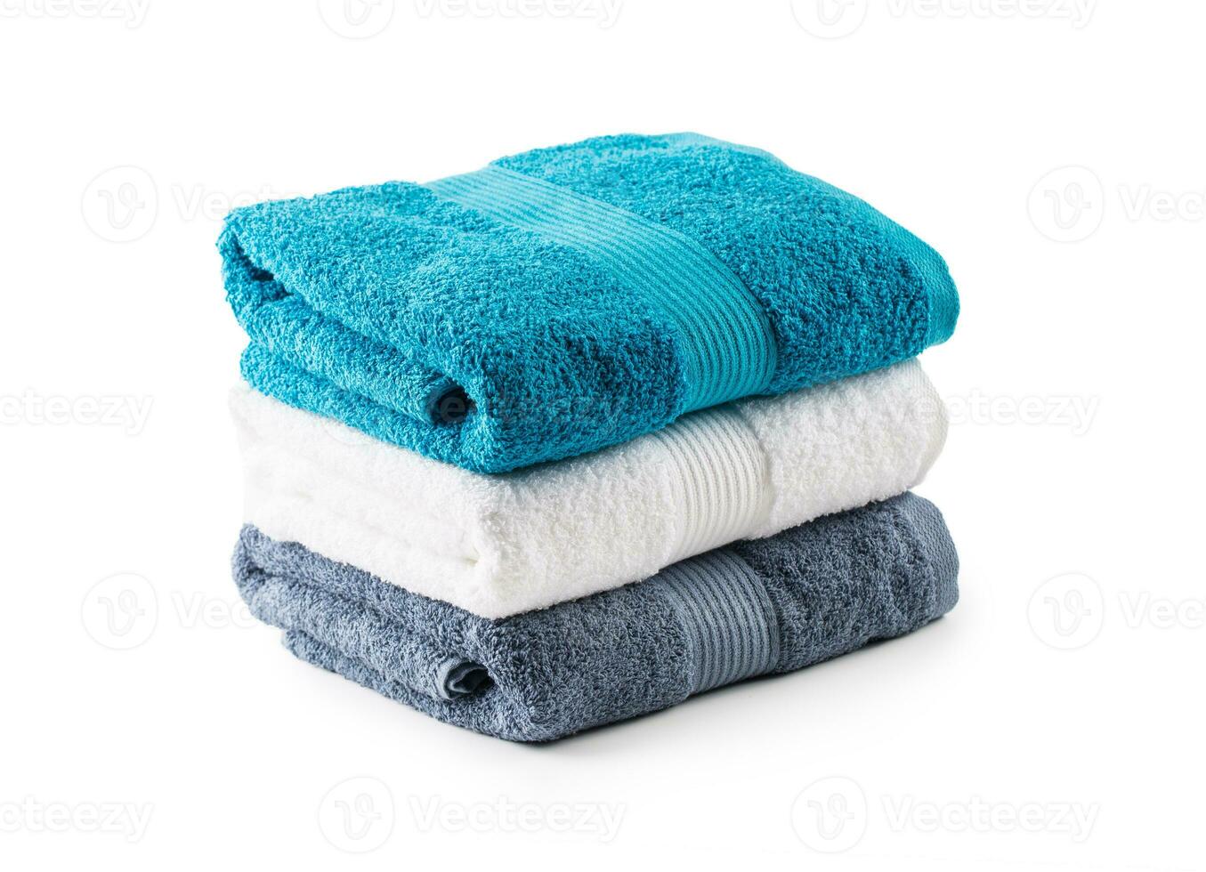 Stacked blue white and gray towels isolated on white photo