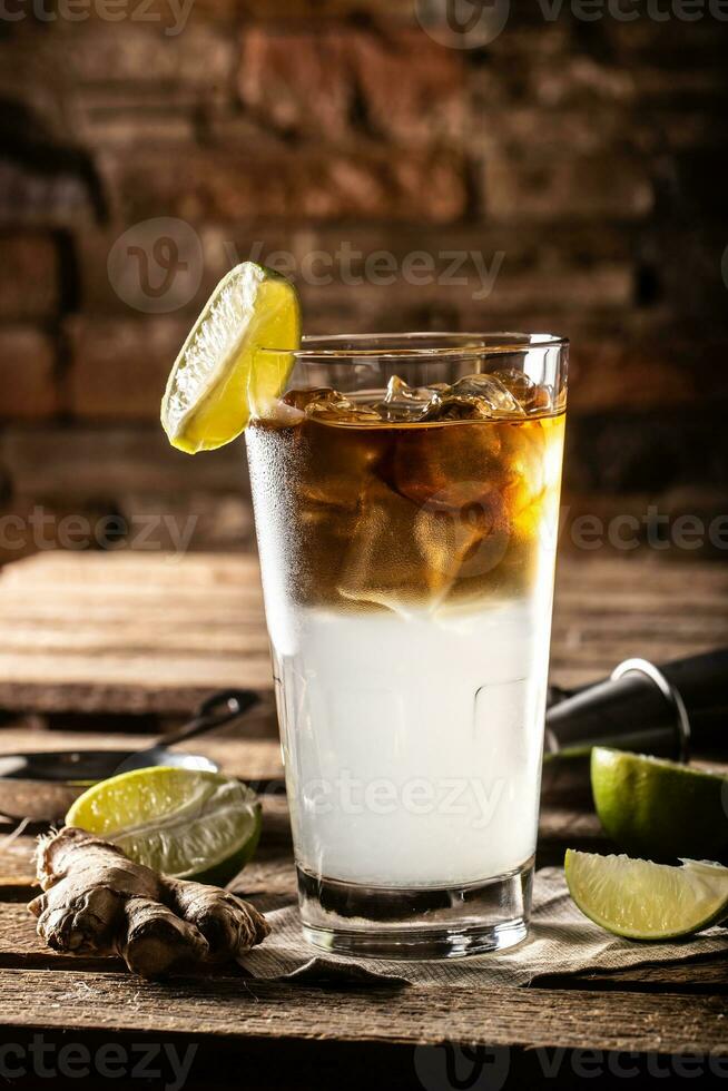 Dark n Stormy highball cocktail served as a long drink with rum, fresh lime juice, and ginger beer photo