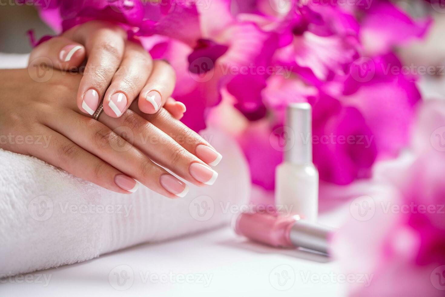 Closeup shot of beautiful female dands with nails of france manicure. Manicure and spa concept photo