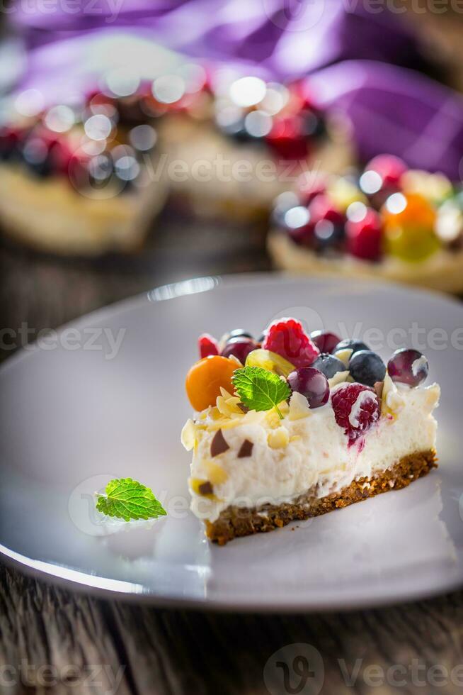 Cheesecake with fresh fruit berries strawberries raspberries and star anise. Christmas cheesecake with christmas decoration photo