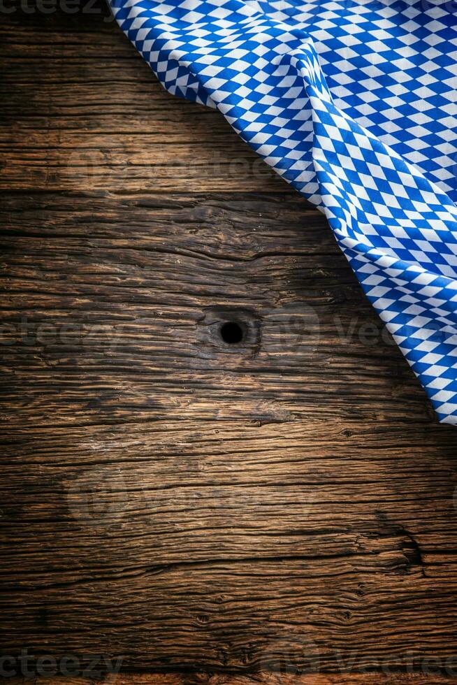 Oktoberfest. The blue checkered tablecloth or napkin typical of the Munich Beer Festival in the German Oktoberfest. Free space for your text product or information photo