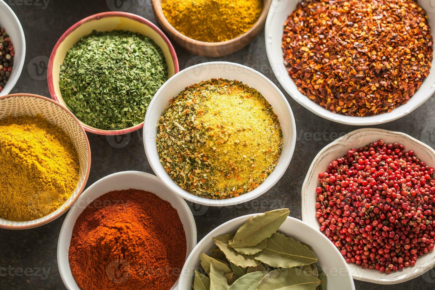 Set of variety aromatic spices and herbs in bowls photo