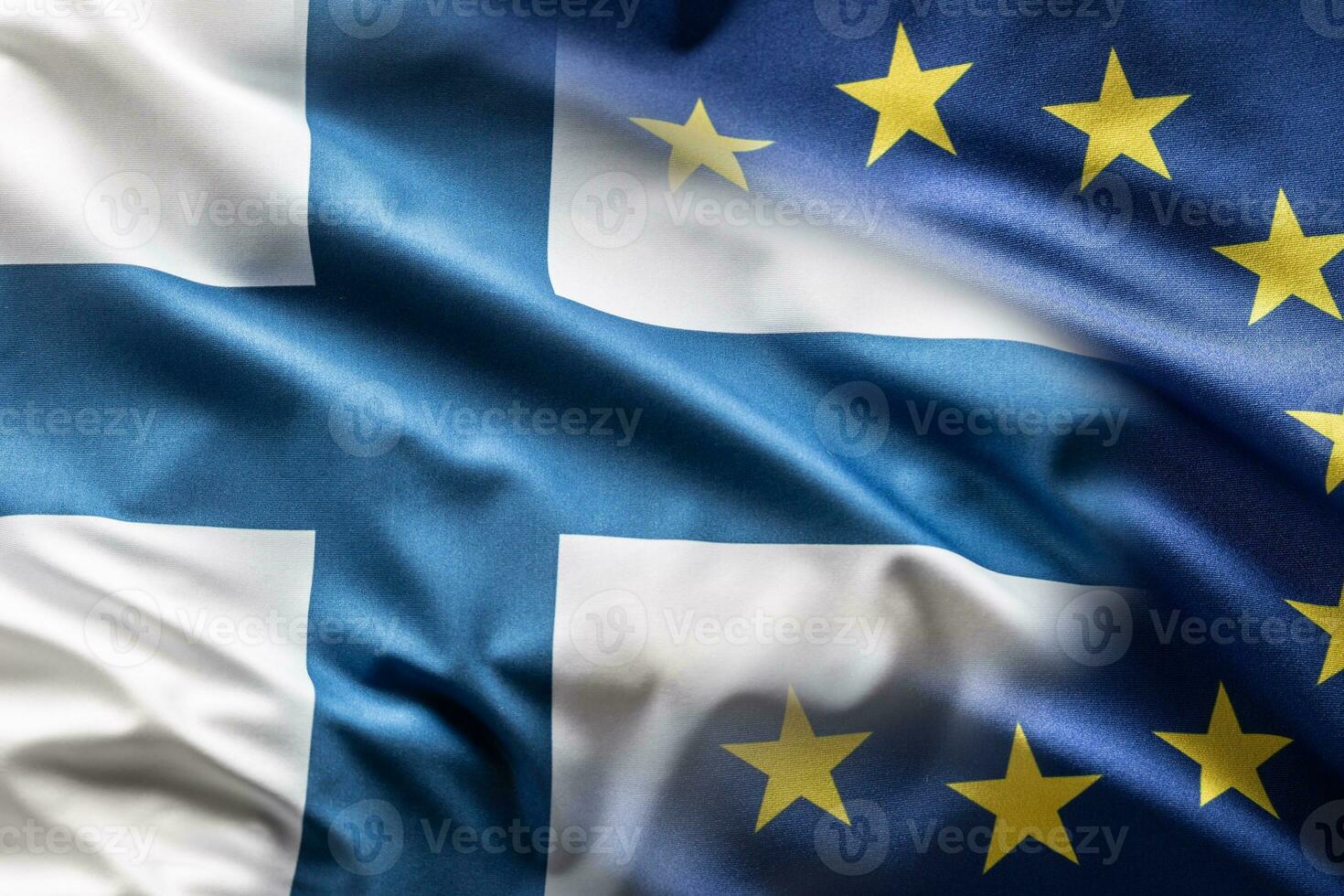 Flags of Finland and EU blowing in the wind photo