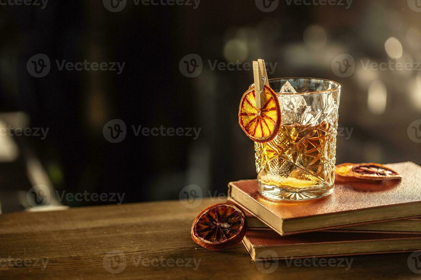 Glass cup with Old Fashioned cocktail in retro style photo