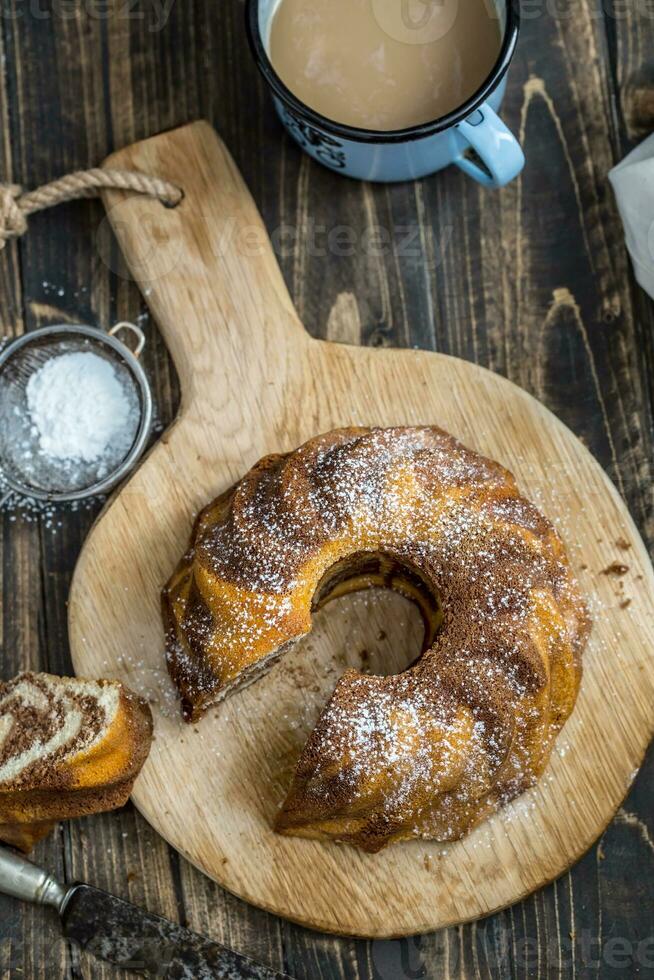 Cake. Marble cake cup of coffee powder sugar kitchen vintage utensil and fresh fruit berries photo