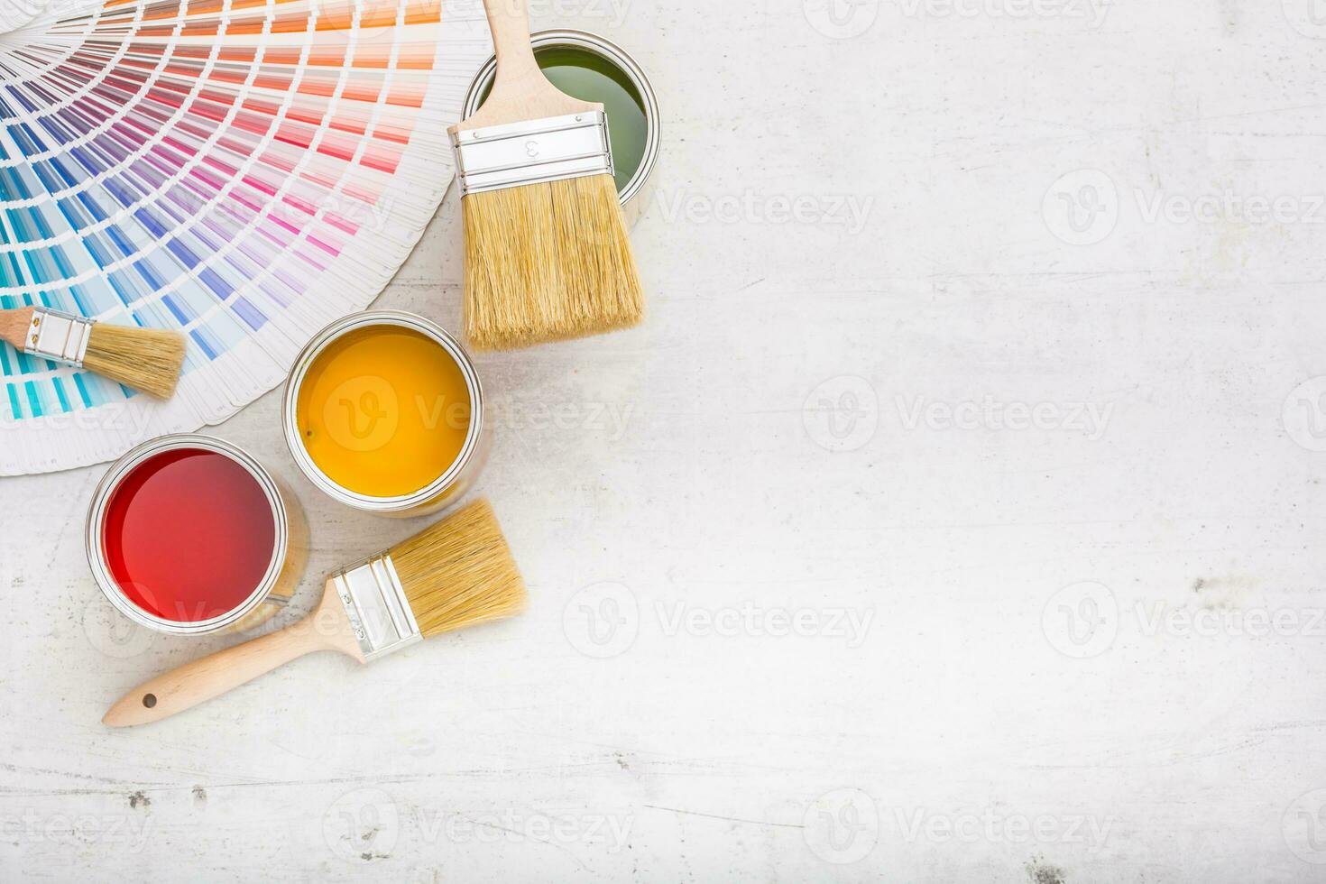 Paint cans color palette, cans opened with brushes on white board photo