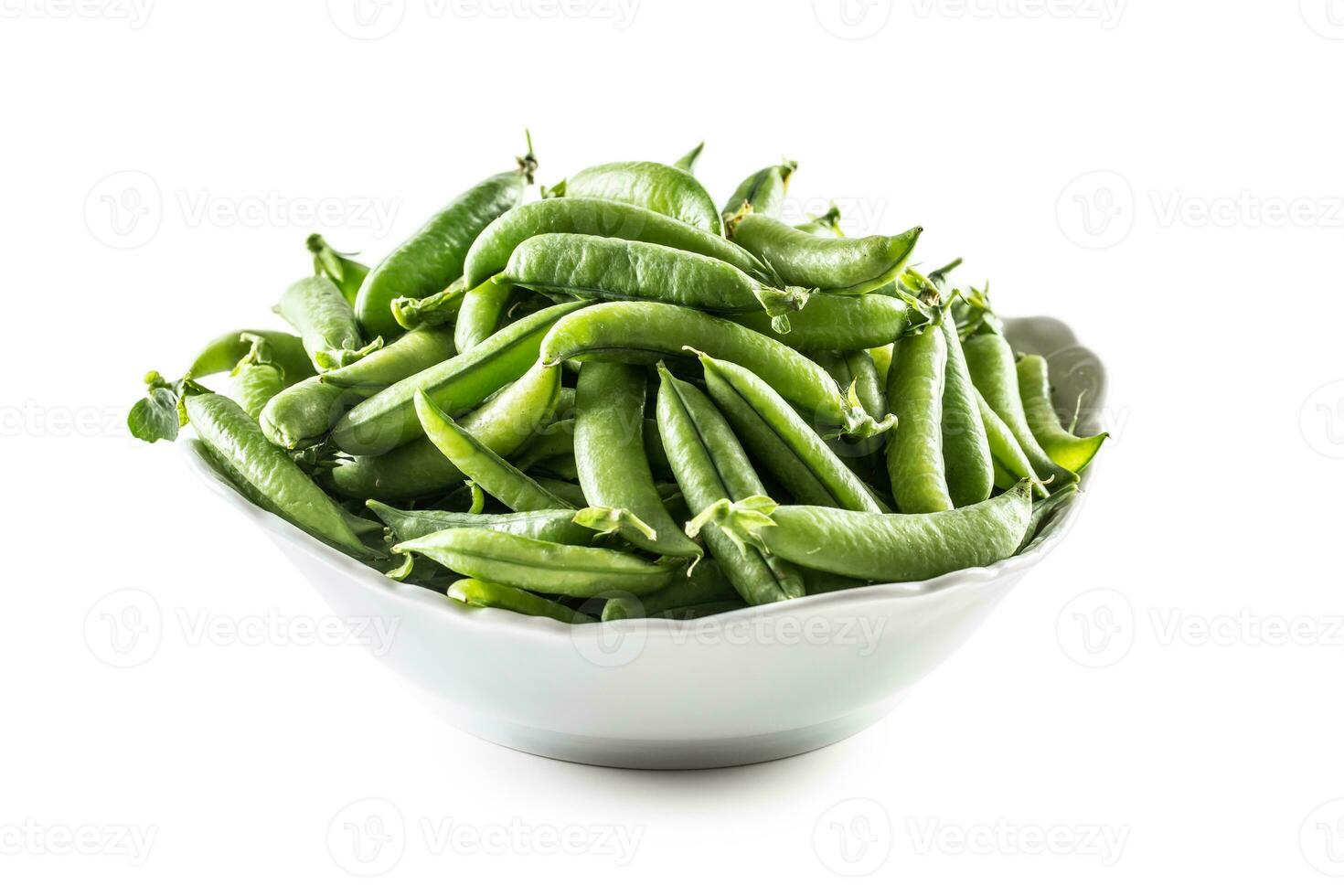 Fresh Green pea pods in white bowl isolated on white background photo