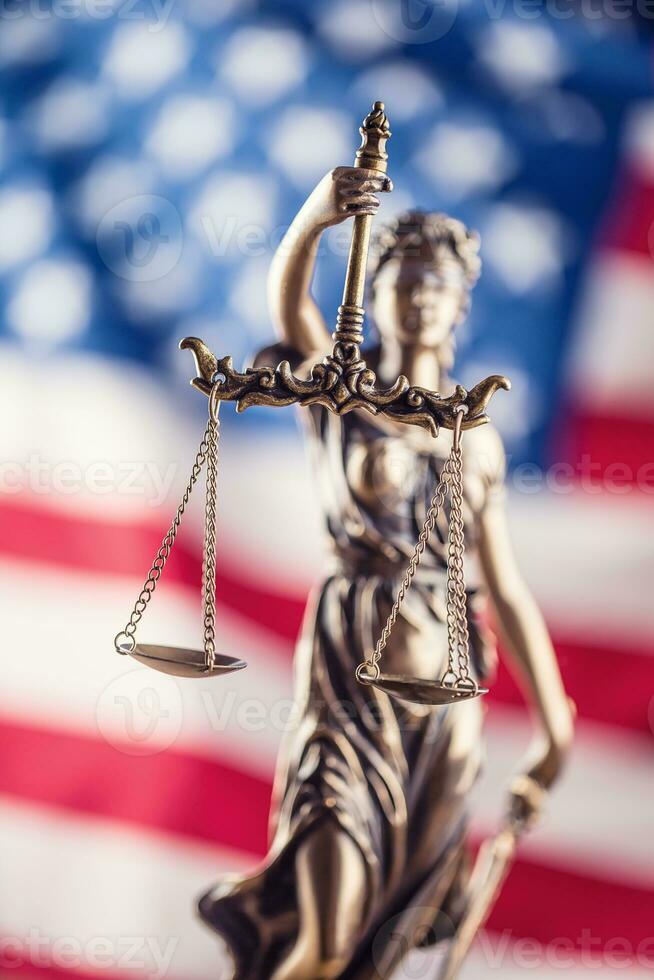 Lady Justice and American flag. Symbol of law and justice with USA Flag photo