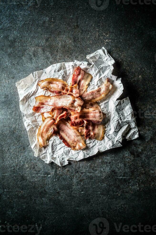 Top of view roasted bacon on paper. photo