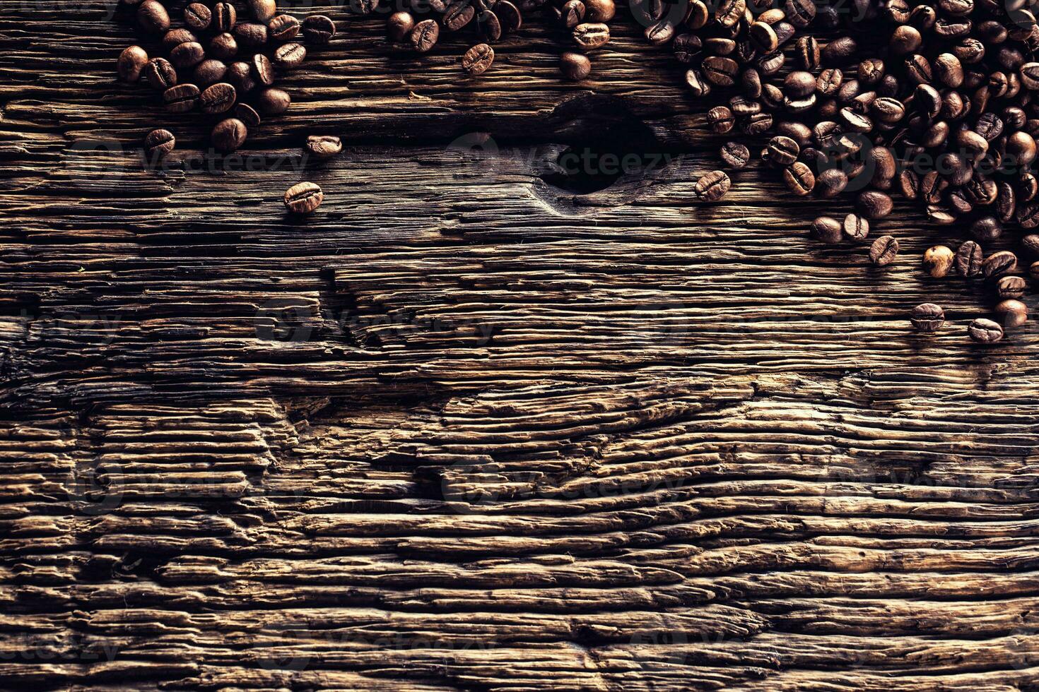Top of view coffee beans on rustic oak table photo
