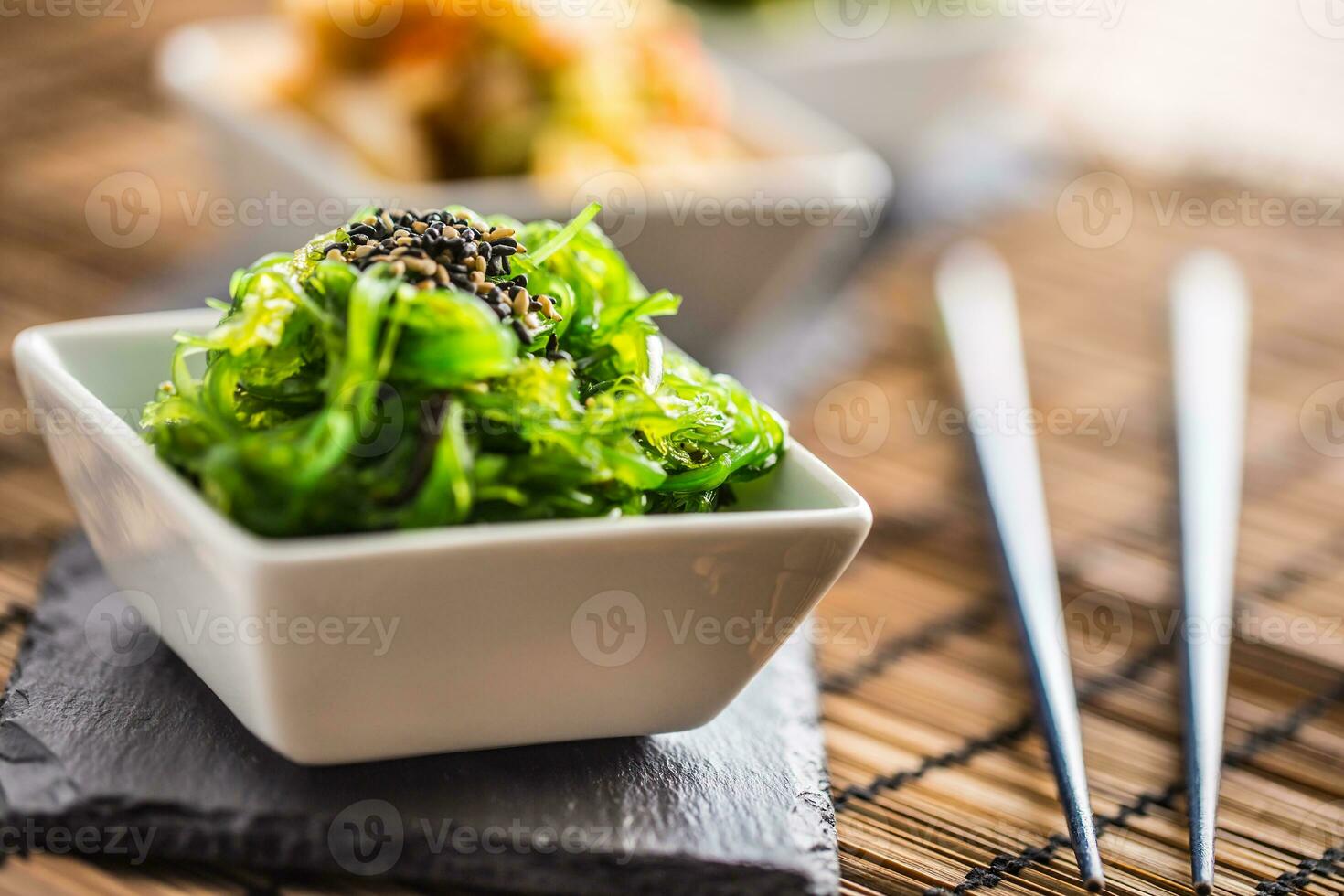 Wakame salad with seaweed and sesame seeds. photo