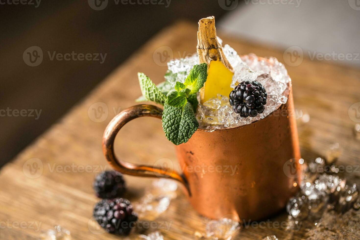 Moscow mule cocktail alcoholic drink on bar counter in pub or restaurant. photo