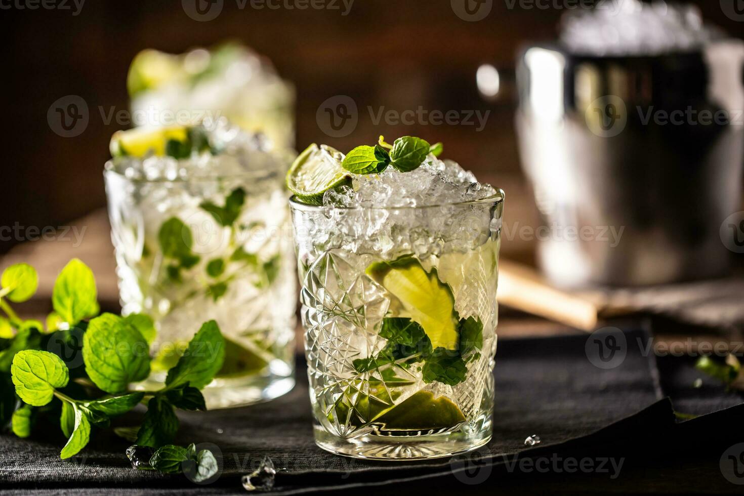 Mojito or virgin mojito long rum drink with fresh mint, lime juice, cane sugar and soda photo