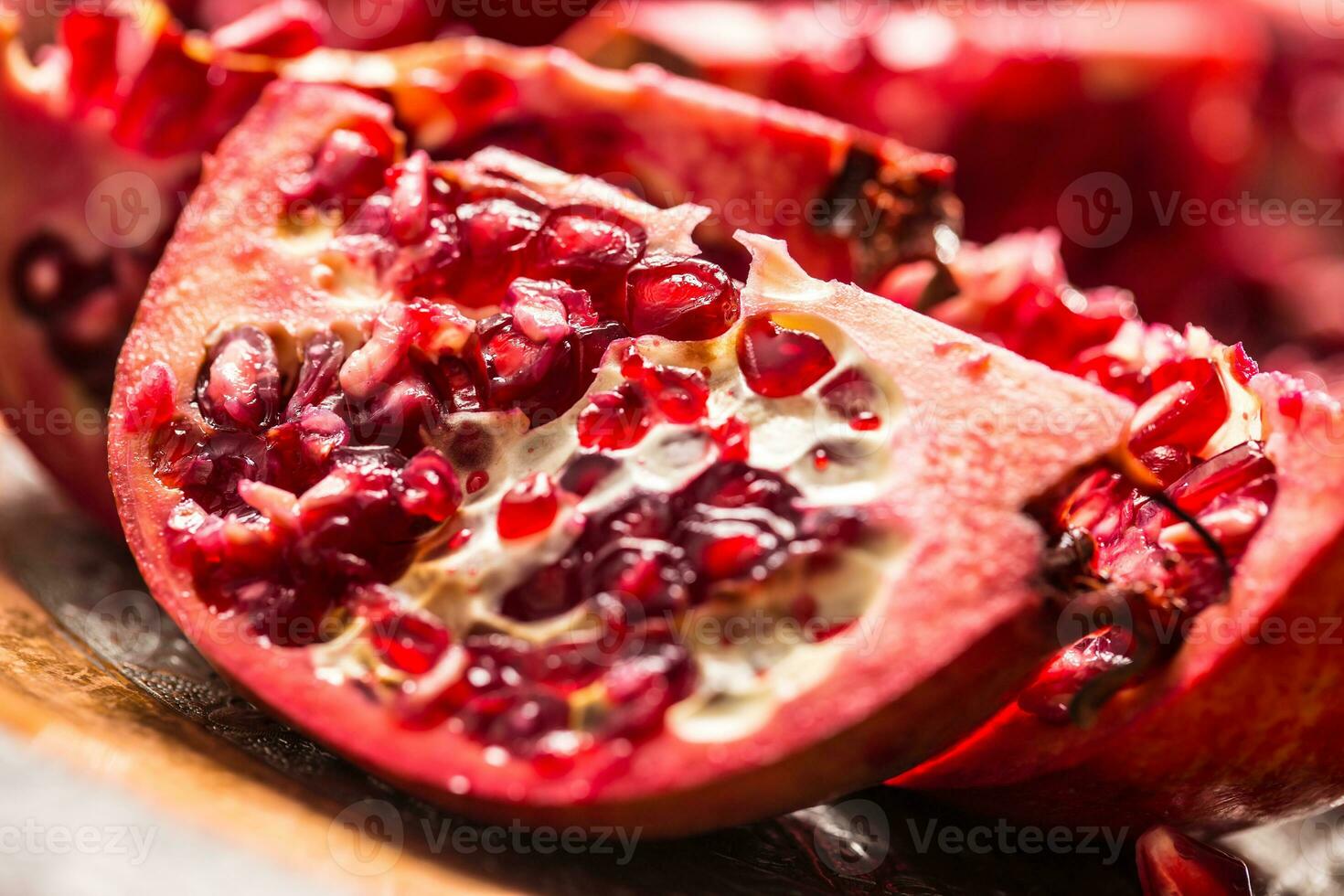 Pomegranate. Pieces of frest pomegranate on plate photo