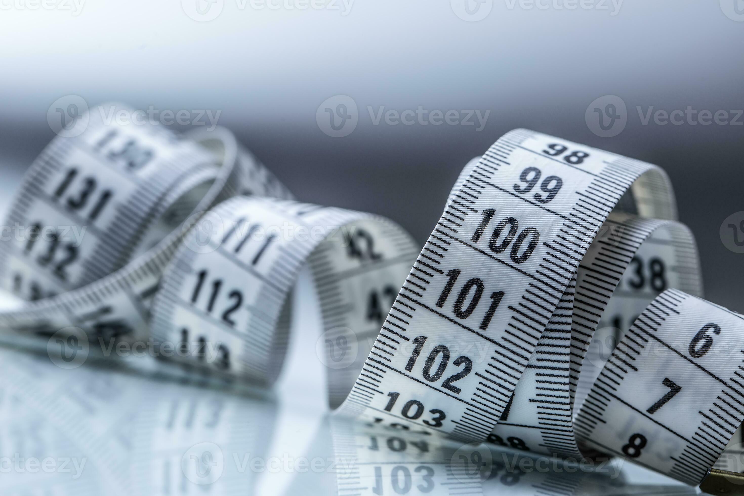 Curved Measuring Tape Measuring Tape Of The Tailor Closeup View Of curved-measuring-tape-measuring-tape-of-the-tailor-closeup-view-of