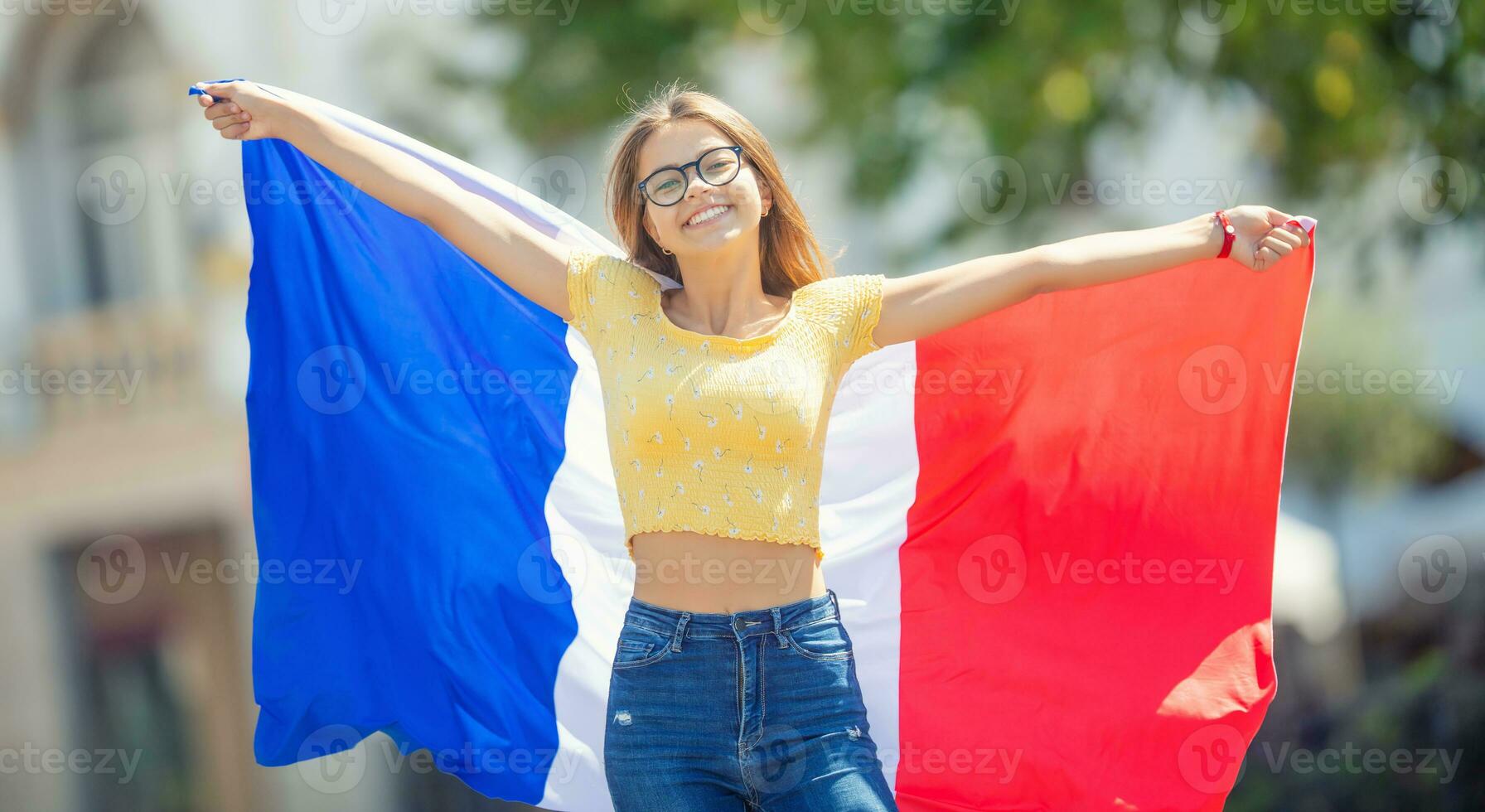 Attractive happy young girl with the Belgian flag photo
