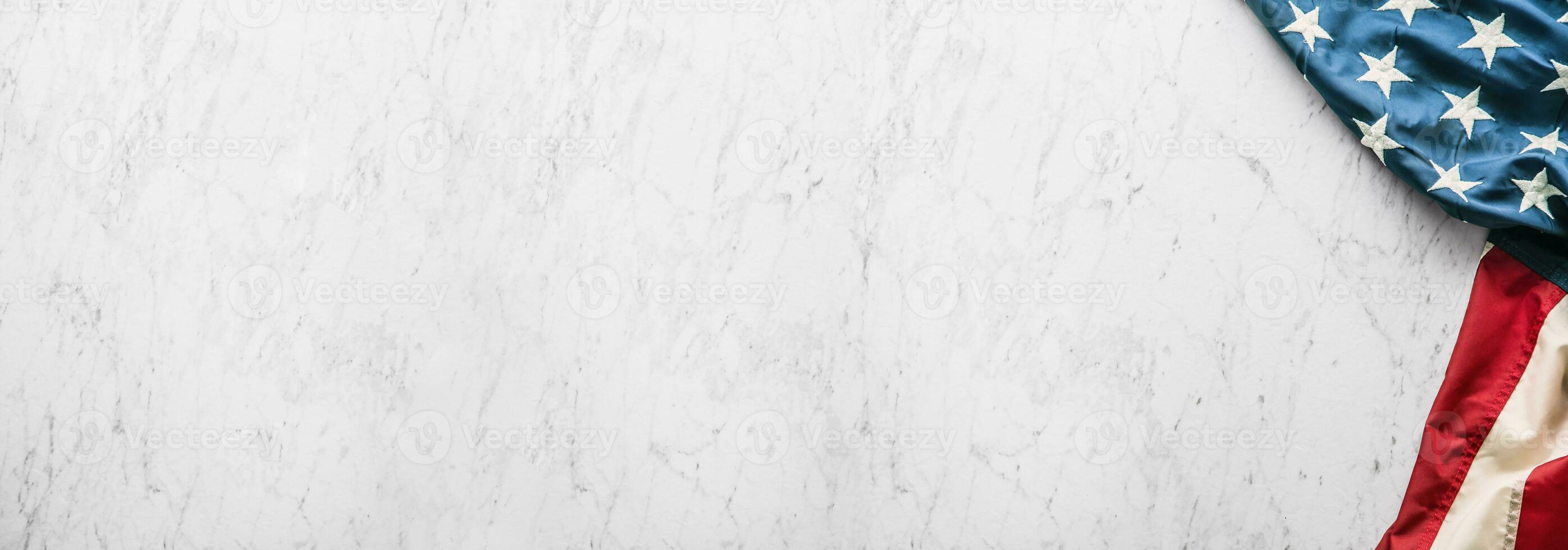 Close-up american flag on white marble background photo