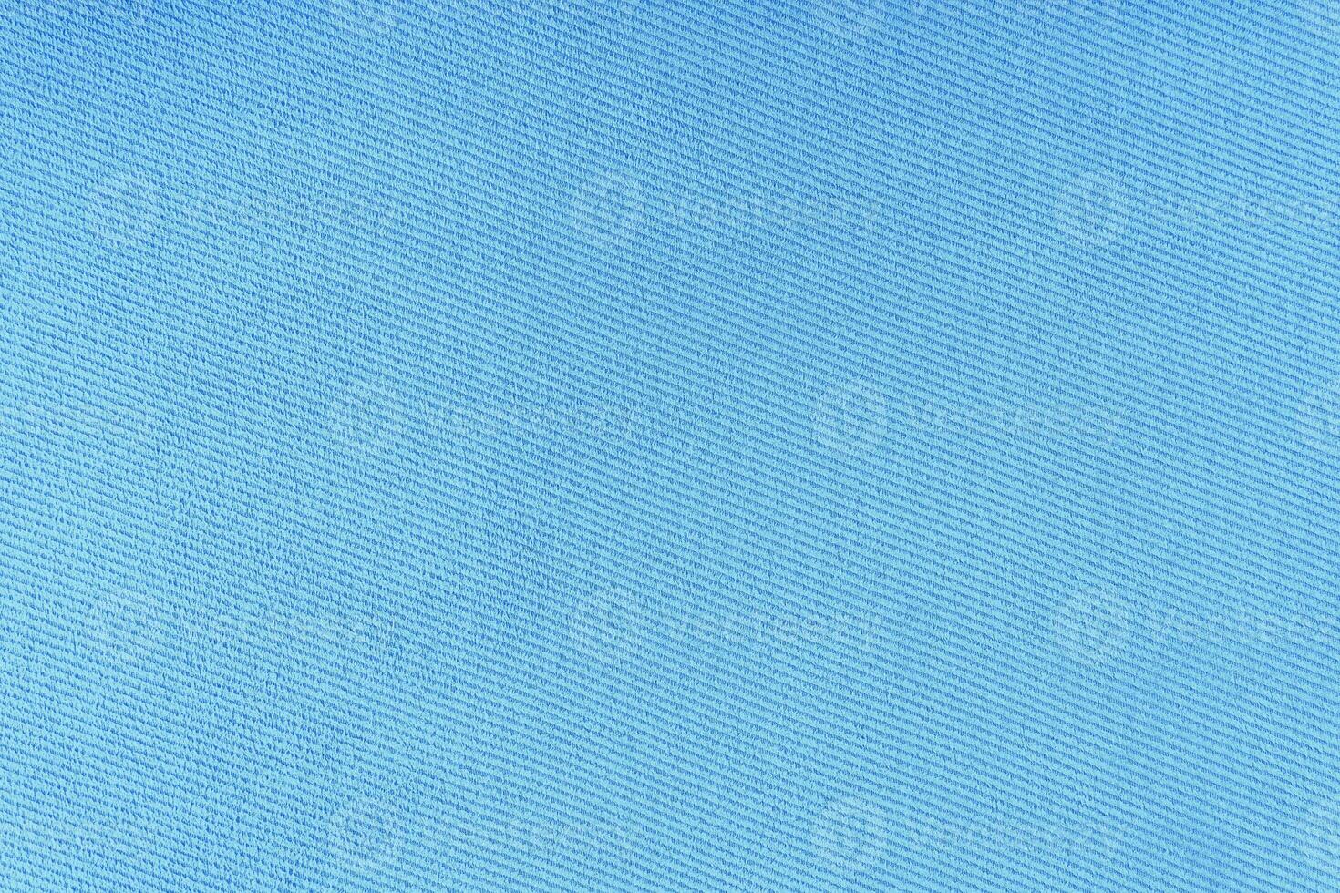 Texture of turquoise fabric diagonal weave pattern. Decorative textile background photo