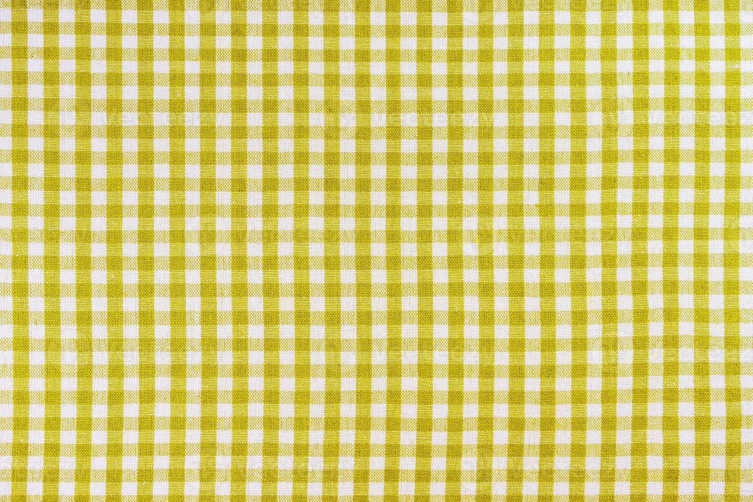 Yellow classic checkered tablecloth texture, background with copy space. photo