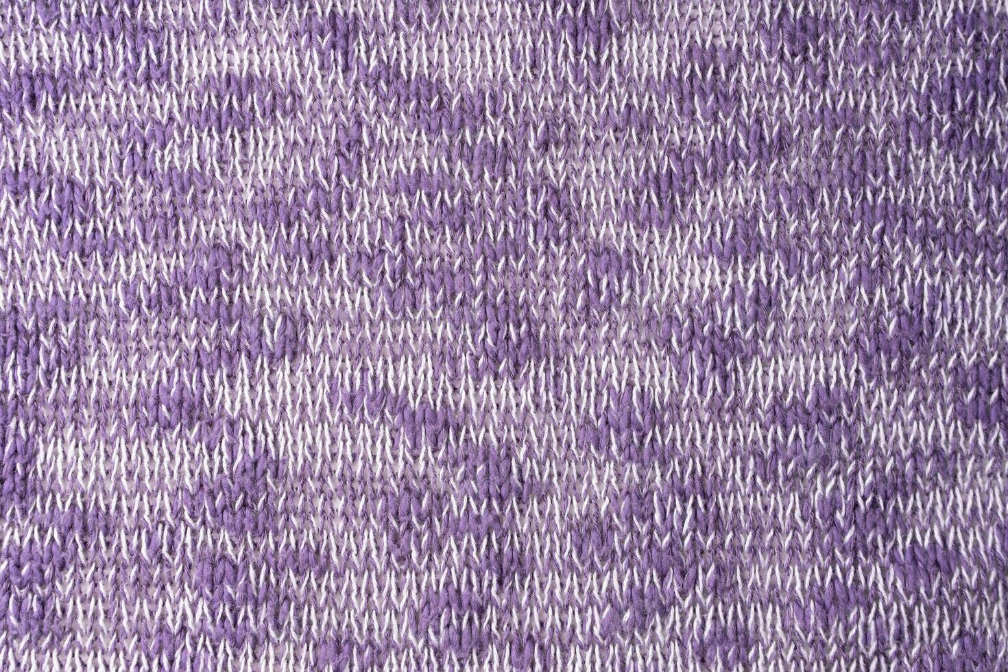 Bright purple white melange knitwear wool fabric texture background. Abstract textile backdrop photo
