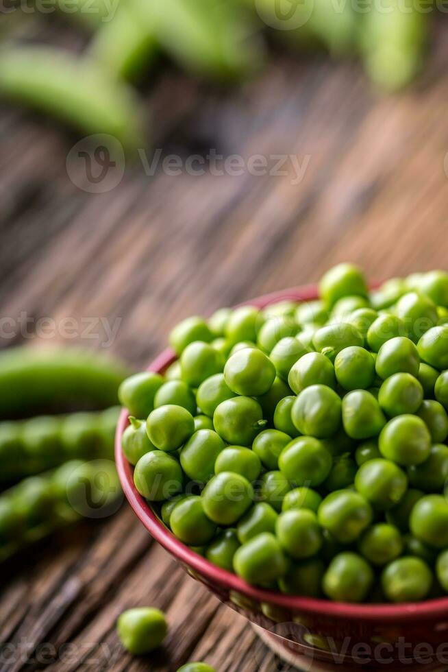 Peas. Fresh bio homemade peas and pods on old oak board. Healthy fresh green vegetable - peas and pods. photo