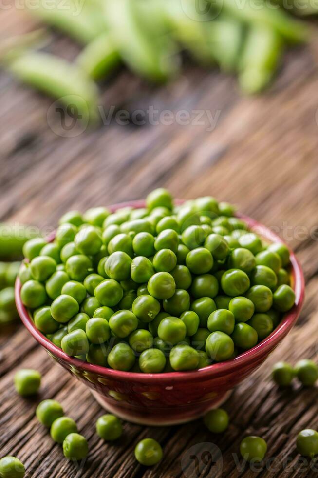 Peas. Fresh bio homemade peas and pods on old oak board. Healthy fresh green vegetable - peas and pods. photo