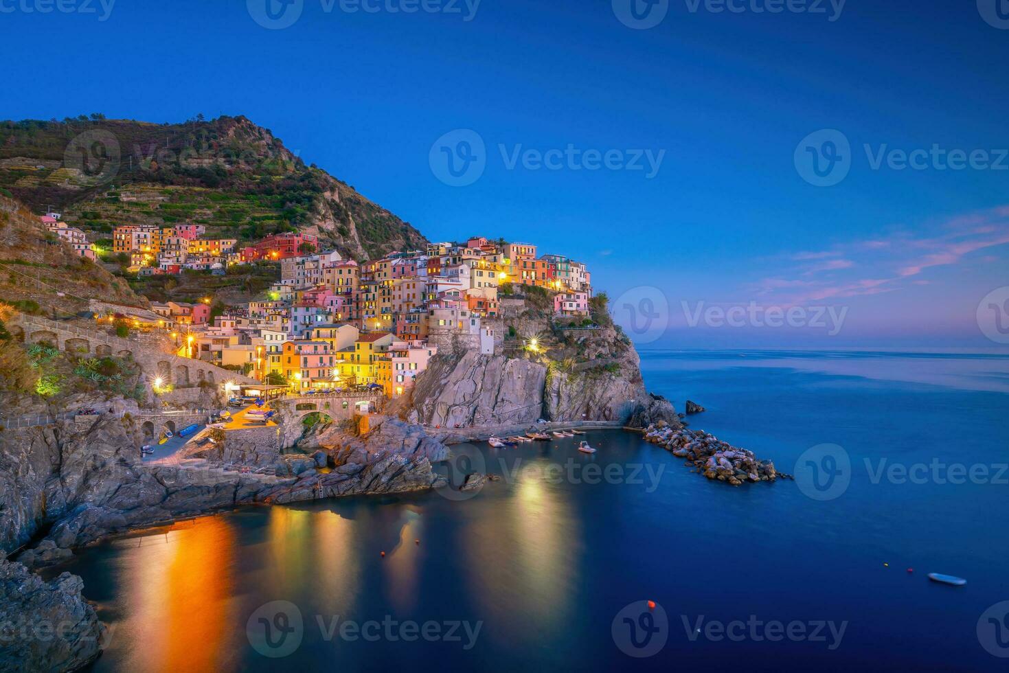 Colorful cityscape of buildings over Mediterranean sea, Europe, Cinque Terre in Italy photo