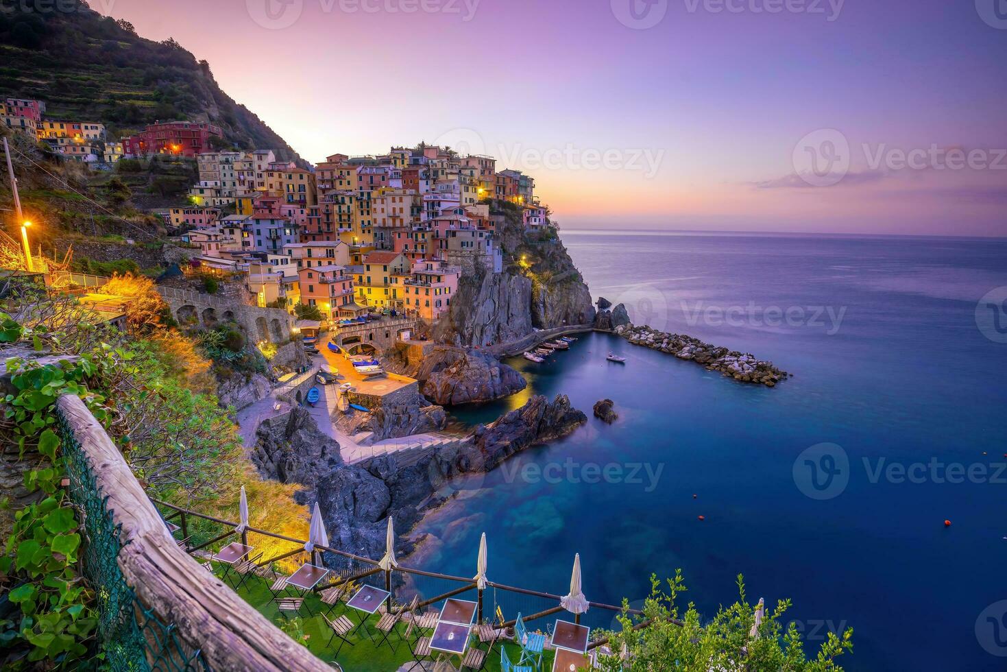 Colorful cityscape of buildings over Mediterranean sea, Europe, Cinque Terre in Italy photo