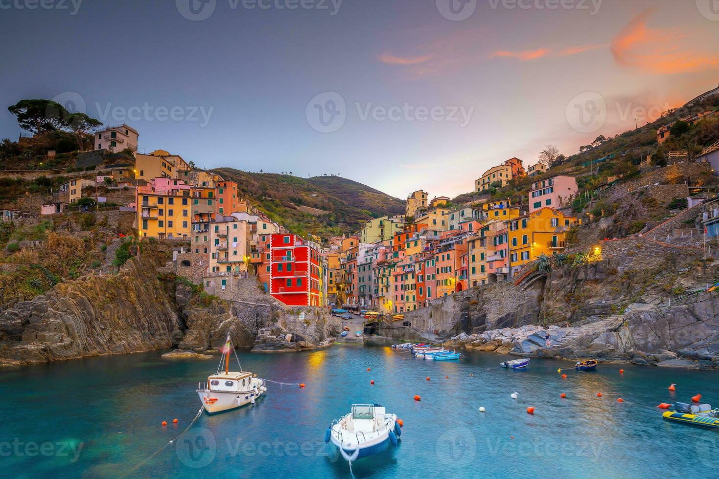 Colorful cityscape of buildings over Mediterranean sea, Europe, Cinque Terre in Italy photo