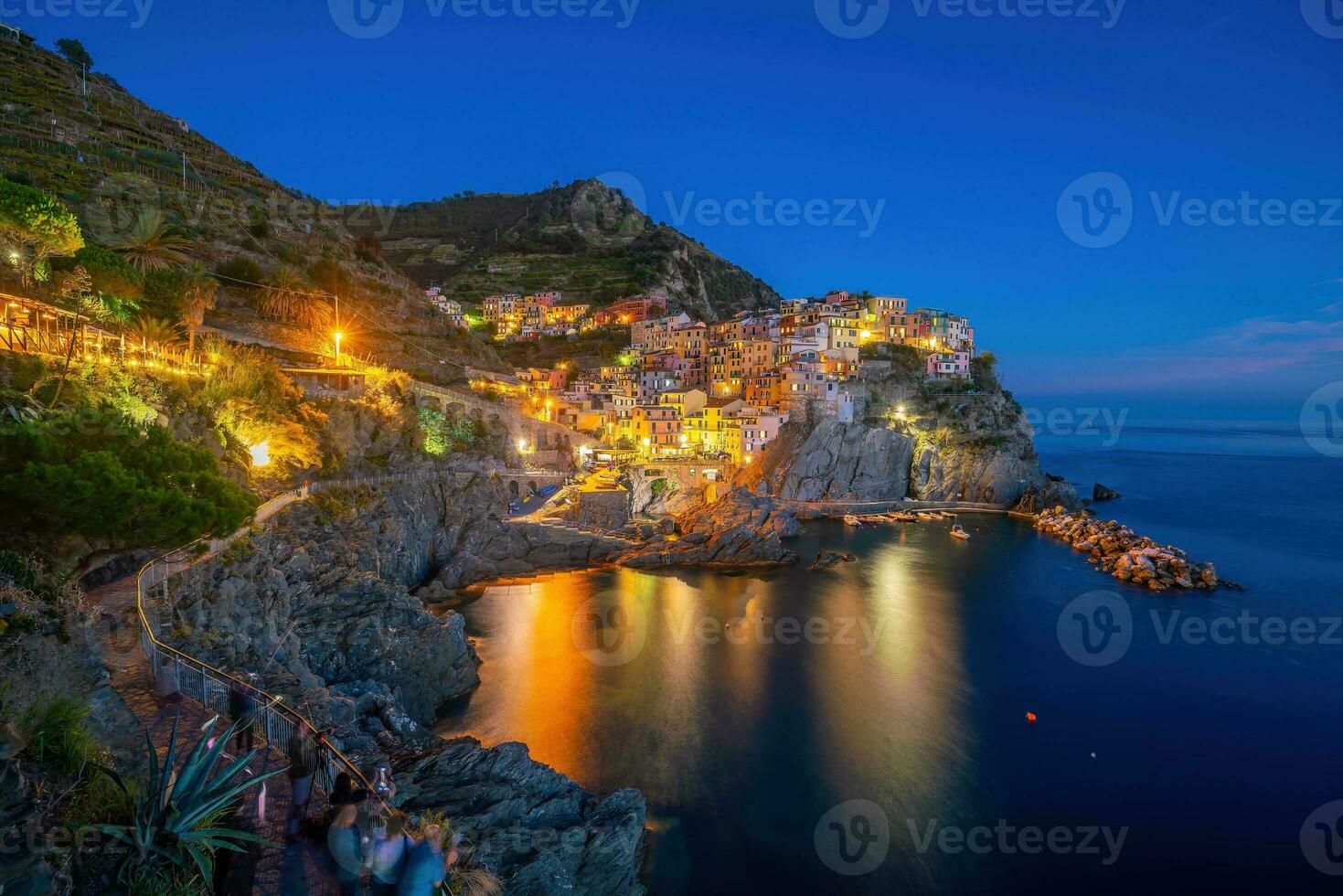 Colorful cityscape of buildings over Mediterranean sea, Europe, Cinque Terre in Italy photo