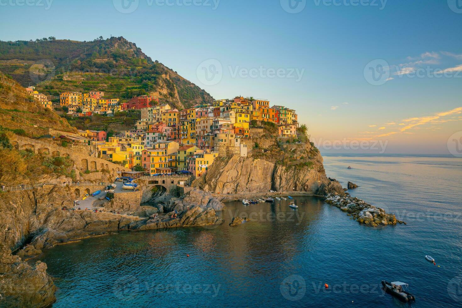 Colorful cityscape of buildings over Mediterranean sea, Europe, Cinque Terre in Italy photo