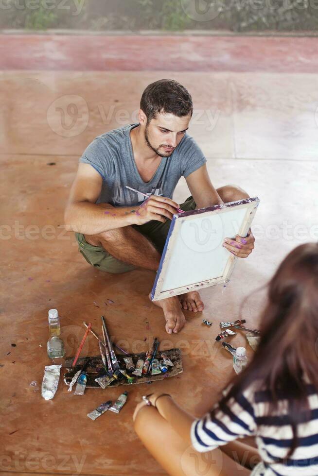 Young man painting photo