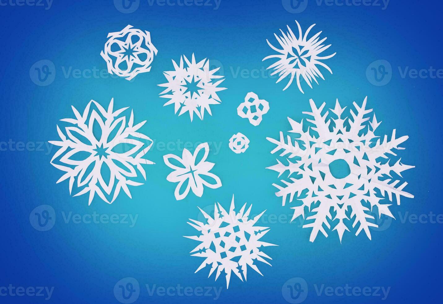 paper snowflakes on a blue background photo