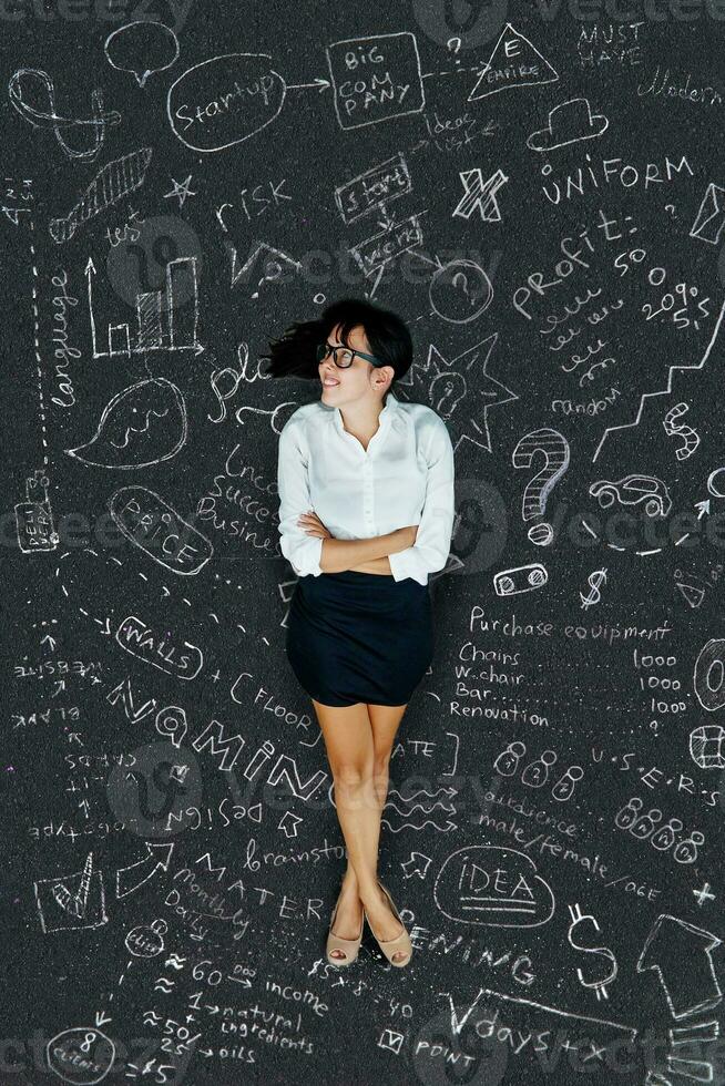 Businesswoman with doodles photo