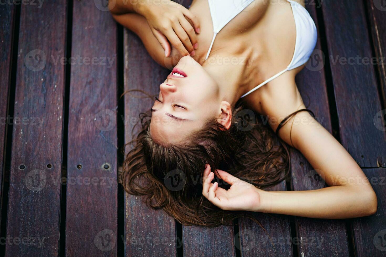 Woman on a wooden floor photo