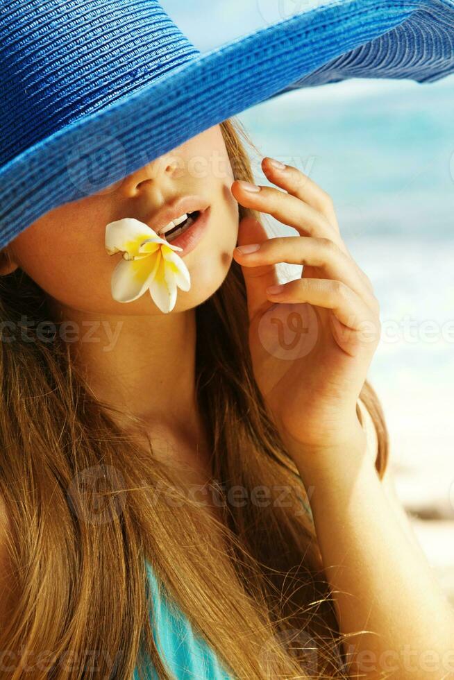 a woman wearing a blue hat photo